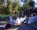 38 Israel, Jordan River.  Pastor blesses those being baptized.